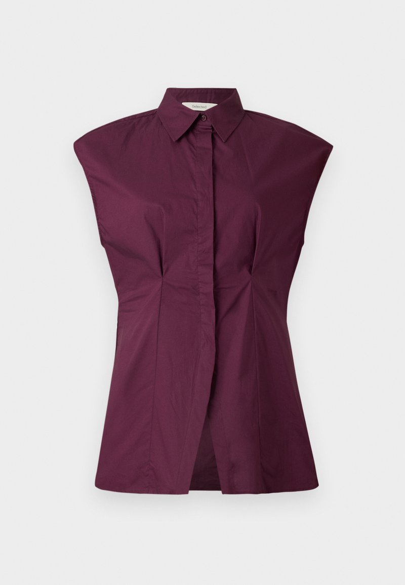 Bordeaux kleurig overhemd met uniek breed schouderontwerp, plooien aan de voorkant en een naadloze afwerking, gemaakt van een zachte katoenmix.