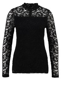 Sort blonde top med lange ærmer, mock neck-design, blomsterprint og en semi-gennemsigtig tekstur. Har en knaplukning ved halsen.