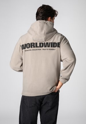 WORLDWIDE  - Kapuzenpullover - middle-beige