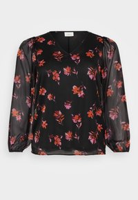 Svart blus med genomskinliga, puffade långärmar. Har en V-ringning och blommönster i orange och rosa nyanser över hela. Lätt vikt fabric.