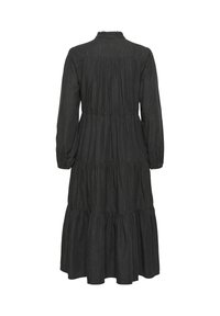 Long dark gray tiered dress with long sleeves, gathered waist, and a small ruffle detail at the back neckline.