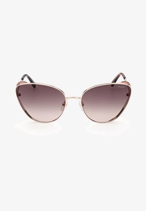 Gafas de sol tipo cat-eye con un marco metálico dorado, lentes oscuros degradados y brazos con acentos en negro. Incluye almohadillas nasales transparentes para mayor comodidad.