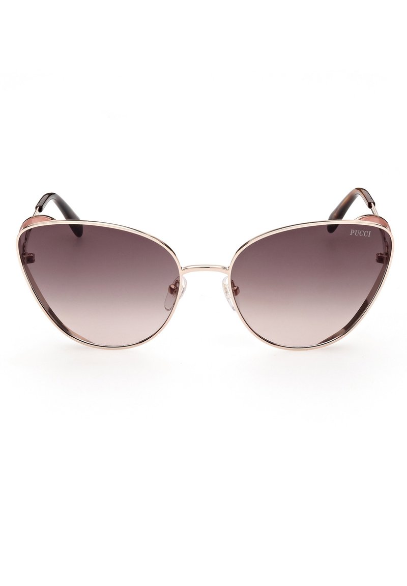 Gafas de sol tipo cat-eye con un marco metálico dorado, lentes oscuros degradados y brazos con acentos en negro. Incluye almohadillas nasales transparentes para mayor comodidad.