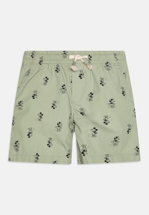 Hellgrüne Shorts mit schwarzen Mickey-Maus-Illustrationen und einem weißen Kordelzug am elastischen Bund.