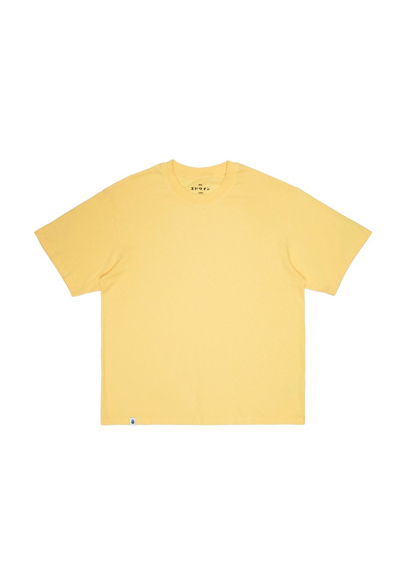 T-shirt a maniche corte e colletto rotondo in morbido cotone giallo chiaro. Presenta una vestibilità dritta e un'etichetta piccola attaccata all'orlo laterale.