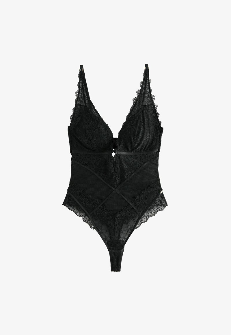 Body in pizzo nero con rete trasparente, motivi floreali intricati, spalline regolabili e dettaglio a chiave frontale. Accenti incrociati in vita.