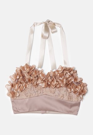 Nude-colored bralette featuring floral embellishments, lace fabric, satin underlay, and adjustable satin ribbons.