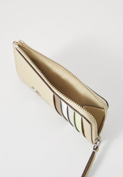 Beige zippered wallet with a textured exterior, featuring multiple card slots in varying pastel colors and a fabric interior lining.