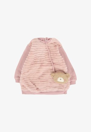 Abito in peluche rosa con texture arricciata, maniche lunghe e tasca a forma di orso. Tessuto morbido, forma arrotondata e colore delle maniche contrastante.