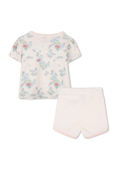 T-shirt en coton floral rose clair à manches courtes et col en dentelle assorti à un short doux avec un design uni.