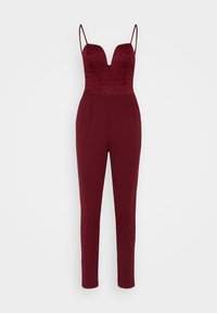 Burgunderfarget jumpsuit med blondeoverdel, dyp U-hals, tynne stropper, avsmalnende ben og en glatt stofffinish.