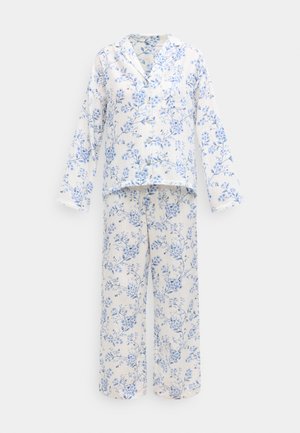 Pyjamaset med blommönster i lätt tyg. Överdel med krage, knappar och långa ärmar. Byxorna har en lös passform och matchande mönster.