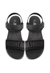 Sandali neri con una soletta testurizzata, due cinghie regolabili con fibbie e una suola in gomma solida per stabilità e comfort.