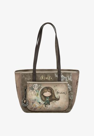 Beige tote bag met donkerbruine hengsels, met een illustratie van een meisje op het voorvak. De tekst luidt: "Je bent gemaakt van magie" en "de wereld van dromen."