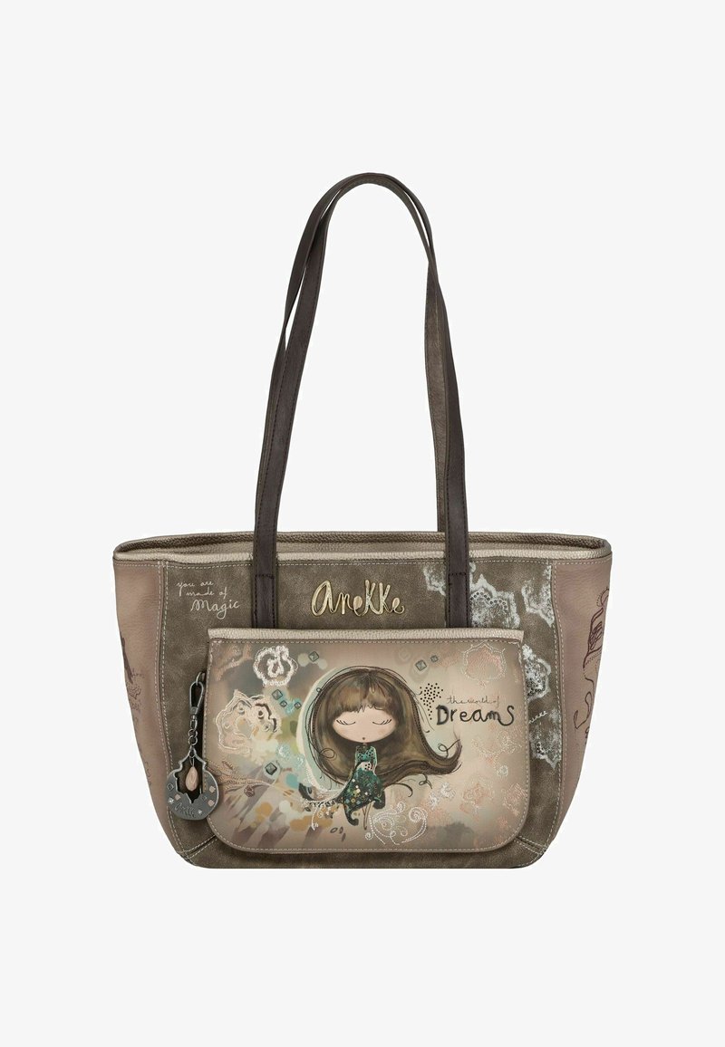 Sac fourre-tout beige avec des poignées marron foncé, présentant une illustration d'une fille sur la poche avant. Les textes indiquent "Tu es fait de magie" et "le monde des rêves."