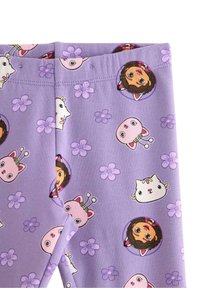 Fioletowe legginsy z zabawnym wzorem postaci z kreskówek i kwiatów; miękki, elastyczny materiał z elastycznym pasem.