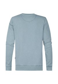 Felpa azzurra chiara realizzata in tessuto morbido, con maniche lunghe, scollo rotondo, polsini a coste e orlo dritto. Nessun motivo visibile.