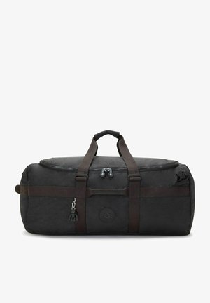 Sort duffel taske i slidstærkt stof, med dobbelte bærehandtag, lynlåslukning og et rundt logo-patch på siden. Mørkebrune detaljer.