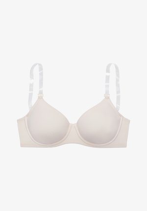 Beiger Bügel-BH mit geformten Körbchen und verstellbaren transparenten Trägern vor weißem Hintergrund.