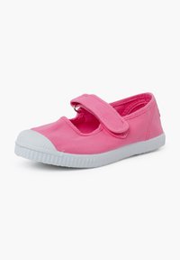 Pink canvas shoe with a rounded toe, white rubber sole, and adjustable Velcro strap. Smooth texture and casual design.