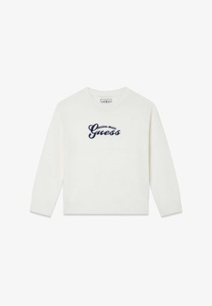 Bijeli džemper od mekanog tkanja s rebrastim ovratnikom i manšetama, s vezanim tamnoplavim logotipom "Guess" u sredini.