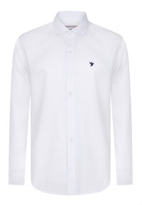 Camisa blanca de manga larga hecha de tela ligera, con un cuello de botonadura y un logo de pájaro en azul marino en el lado izquierdo del pecho.