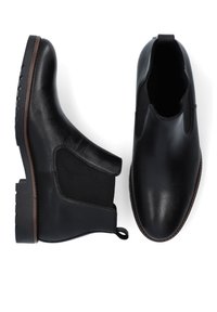 Czarne skórzane botki Chelsea z elastycznymi panelami bocznymi, okrągłym noskiem i teksturowaną gumową podeszwą. Zawierają uchwyt z tyłu ułatwiający zakładanie.