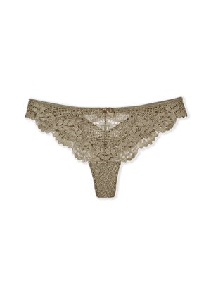 String en dentelle beige avec un motif floral, des bords festonnés et un petit nœud en satin à l'arrière. Présente des détails en dentelle délicats sur l'ensemble.