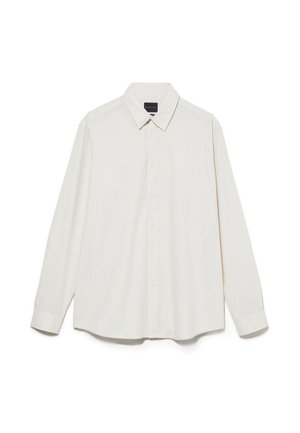 Chemise à manches longues, col ouvert, en crème clair avec de subtiles rayures verticales. Fabriquée en tissu léger, elle dispose d'une fermeture à boutons et de poignets arrondis.