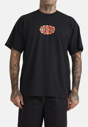 Black cotton t-shirt with short sleeves, featuring a red and gold graphic design on the chest. Relaxed fit and smooth texture.