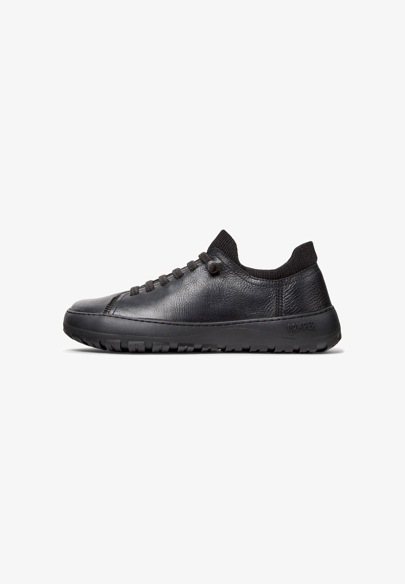 Black leather sneakers with a smooth texture, slim design, round toe, and rubber sole. Features six eyelets and a stretchy knitted collar.