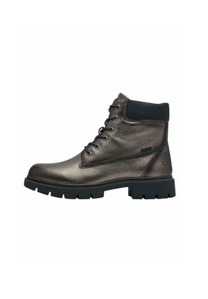 Bottine en cuir marron avec une finition texturée, un col rembourré noir et une semelle en caoutchouc noir présentant un profond relief pour l'adhérence.