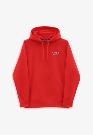 Sweat à capuche rouge avec poche avant et logo Vans sur la poitrine gauche, présenté sur fond blanc.