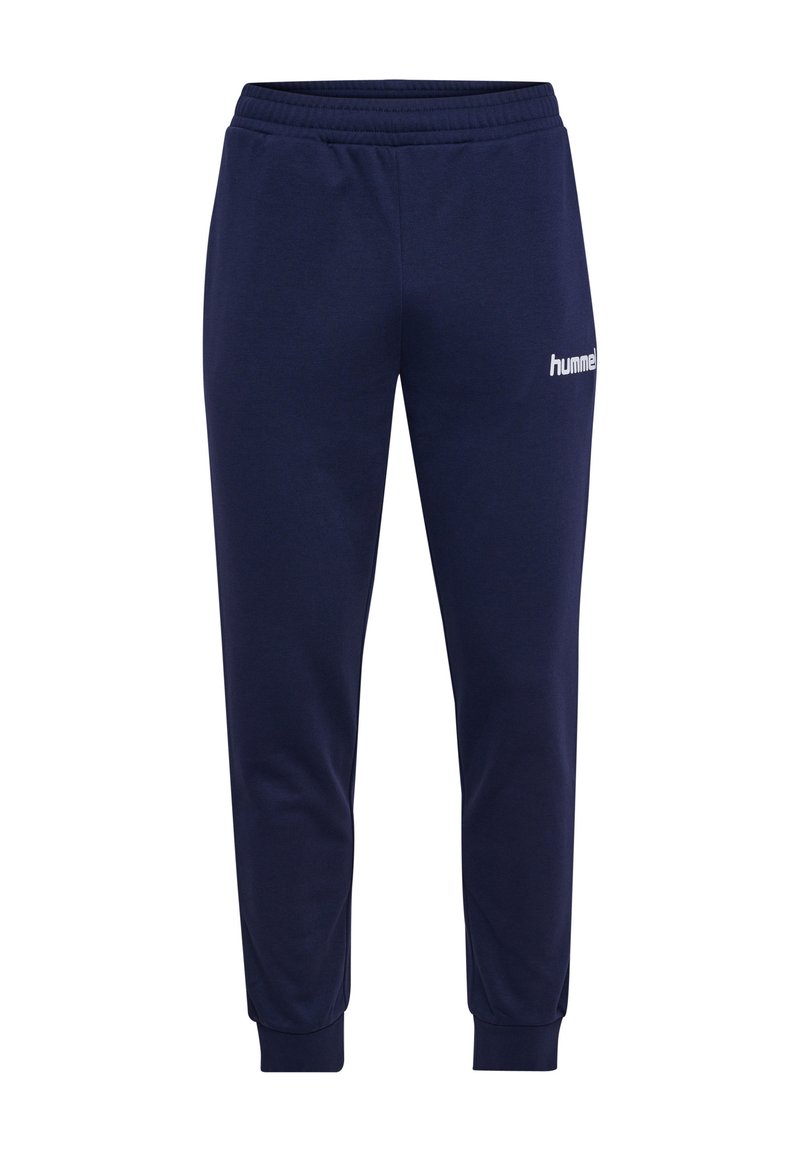 Mørkeblå sweatpants med elastisk talje og tætsiddende manchetter. Har et hvidt "hummel" logo på venstre lår. Fremstillet af blødt stof.