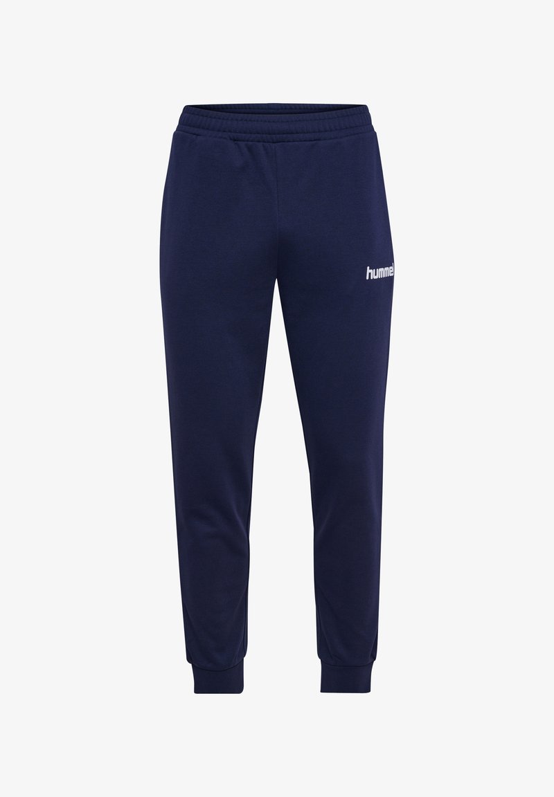 Marineblaue Sweatpants mit einem elastischen Bund und eng anliegenden Bündchen. Mit einem weißen "hummel"-Logo am linken Oberschenkel. Hergestellt aus weichem Stoff.
