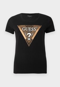 Sort kortærmet t-shirt til kvinder med metallic bronze trekant og leopardprint-logo, der har "GUESS U.S.A" og et spørgsmålstegn.