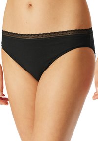 Sous-vêtements en coton noir avec une bordure en dentelle le long de la taille, présentant une texture douce et un design de culotte classique pour le confort et l'ajustement.