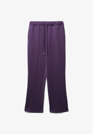 Pantaloni sportivi viola con vita regolabile tramite cordoncino, texture liscia e due cuciture verticali che scorrono lungo la parte frontale. Polsini elastici alle caviglie.