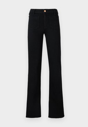 Black high-waist straight-leg jeans with front patch pockets and a copper button closure on a neutral background.
