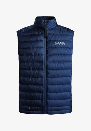 Dunkelblaues, wattiertes Weste aus gesteppter Stoff, mit hohem Kragen und vorderem Reißverschluss. Enthält das Logo "Red Bull Racing" auf der Brust.