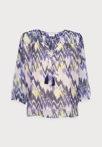 Blusa leggera e trasparente con un motivo zigzag multicolore in viola, giallo e grigio. Presenta un colletto rotondo e dettagli con frange.