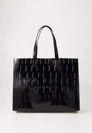 Sac fourre-tout noir en verni, présentant une texture crocodile, un logo en relief "TED BAKER LONDON" et des poignées supérieures doubles pour un transport facile.