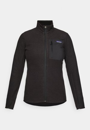Black full-zip fleece jacket with textured pattern, long sleeves, high collar, and zipped chest pocket with brand label.