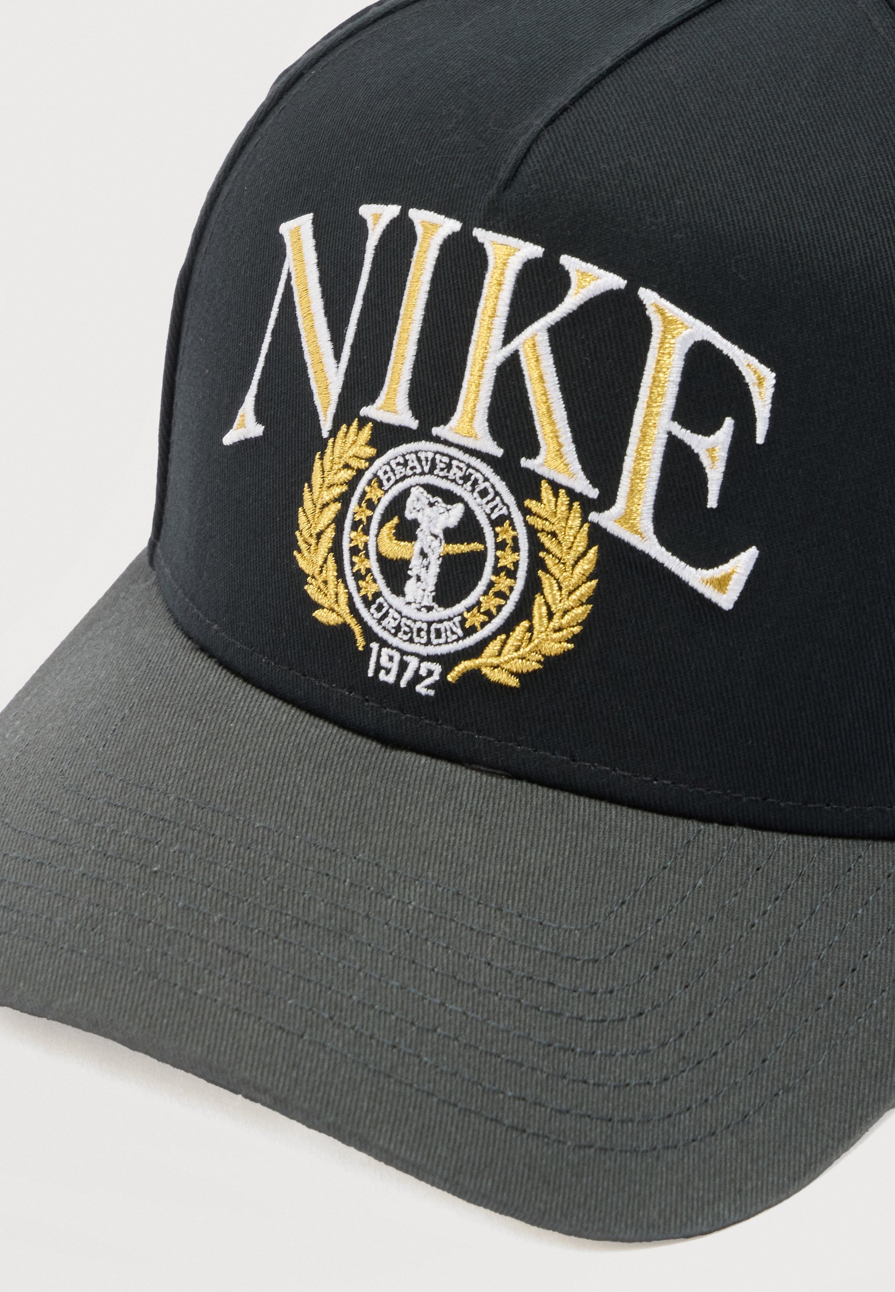 black and gold nike hat
