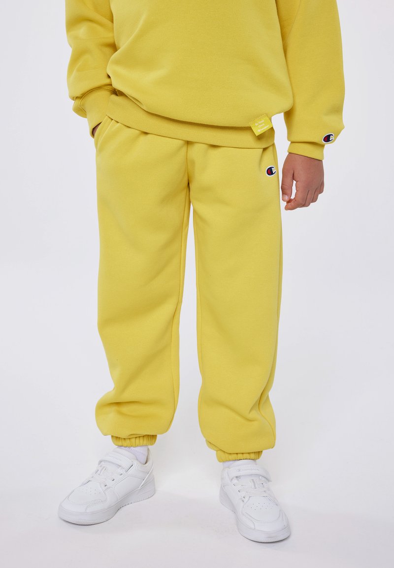 Champion - EXCLUSIVE PANT UNISEX - Tracksuit bottoms - yellow, Enlarge