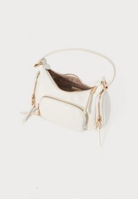 White leather handbag with a structured shape, featuring gold-tone zippers and accents, a single top handle, and a small front pocket.