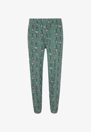 Pantalones de pijama verdes con una cinturilla elástica que presenta un diseño de cascanueces y copos de nieve en rojo, blanco y negro. Diseño ajustado.