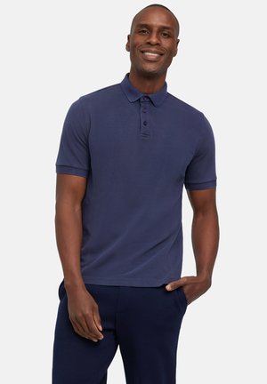 Granatowa koszulka polo z kołnierzykiem, z trzema guzikami z przodu i krótkimi rękawami. Wykonana z teksturowanej tkaniny, doskonale pasuje do ciemnych spodni.