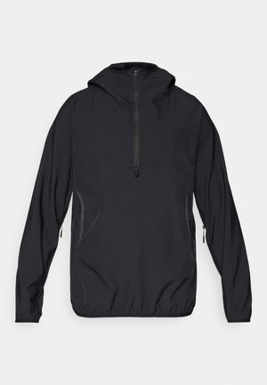 Black pullover jacket with a hood, half-zip front, elasticated hem, and side pockets, made from lightweight, breathable fabric.