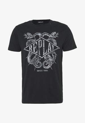 Black cotton t-shirt featuring a silver graphic design with the word "REPLAY" and a snake motif, round neck, short sleeves.